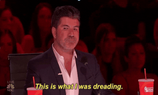 simon cowell reacting to a terrible singer